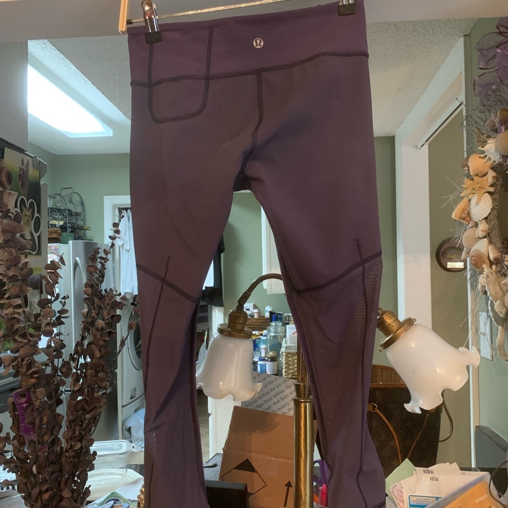 Lululemon Leggings size 4 w/ partial mesh legs. Dark Purple- Inseam 18” EUC